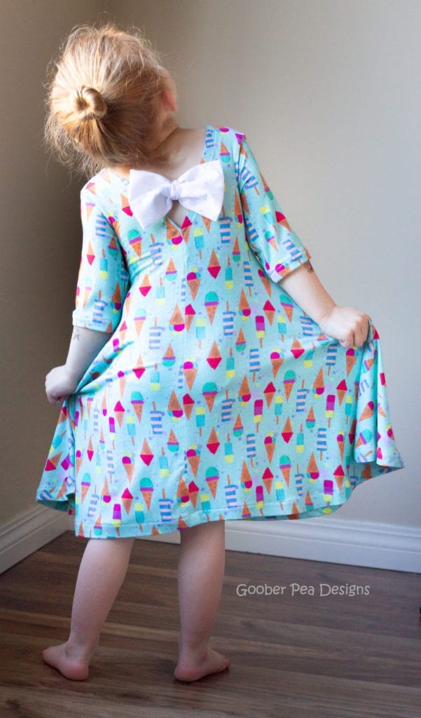 An easy to follow tutorial showing how to combine two PDF sewing patterns to make an adorable bow back dress for babies / toddlers / girls. Multiple sleeve lengths and sleeveless option. Slim skirt or full skirt. 